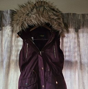 Purple vest with fur lining and hood trim